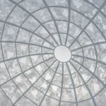Looking upward inside the sphere at overlapping rabbit silhouettes and the open circular top