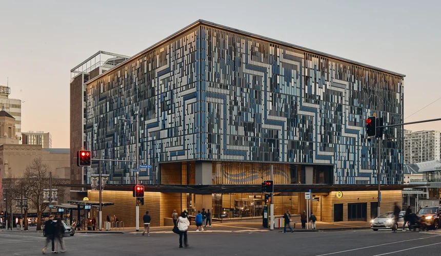 Exterior view of a City Rail Link station with patterned aluminium façade panels