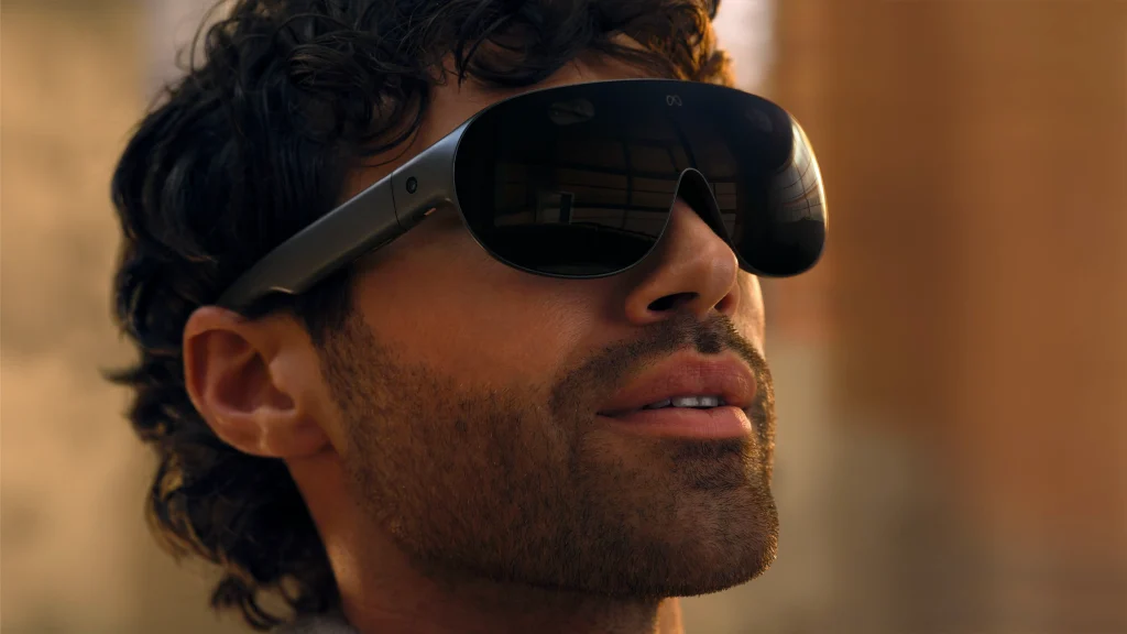Man wearing Meta VR Glasses while seated in a modern interior