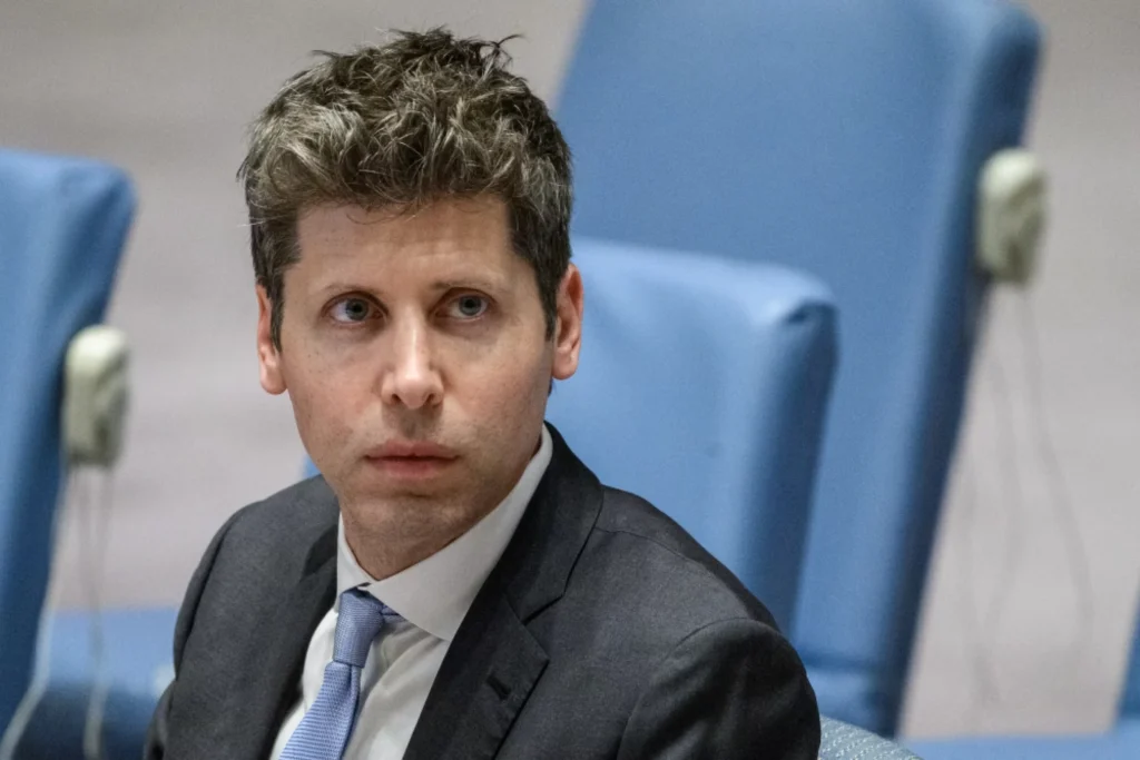 Close-up portrait of Sam Altman in a suit looking slightly aside