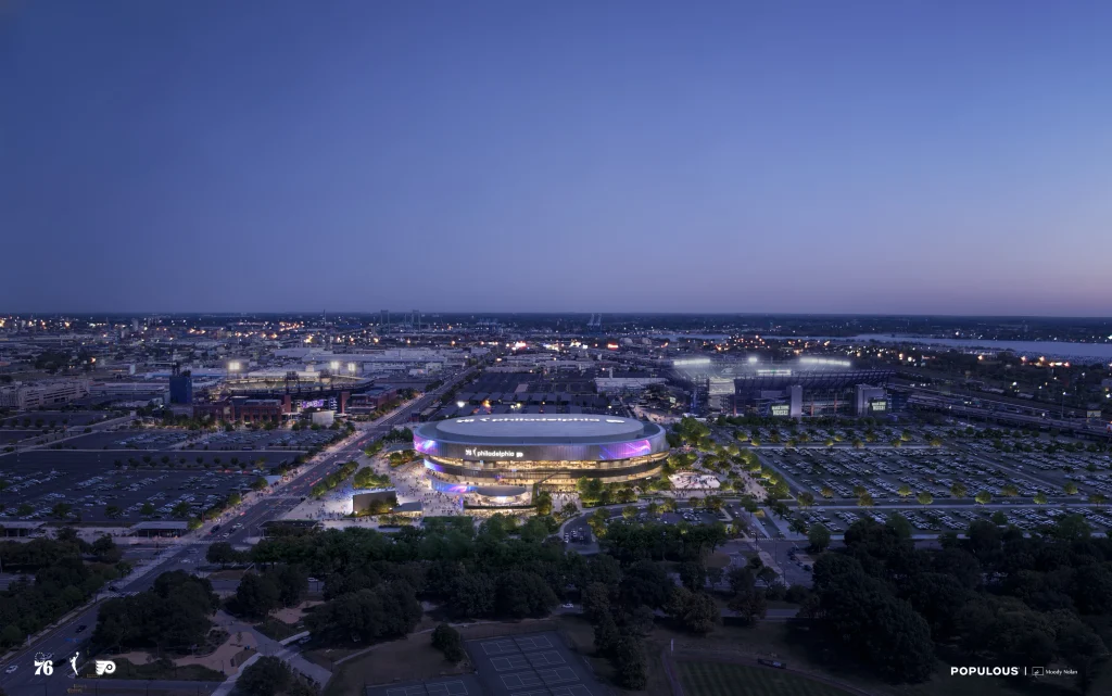 Wide aerial night-time rendering of the South Philadelphia Sports Complex, showing the arena lit in purple amid the surrounding cityscape, roads, and neighboring stadiums.