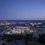 Wide aerial night-time rendering of the South Philadelphia Sports Complex, showing the arena lit in purple amid the surrounding cityscape, roads, and neighboring stadiums.