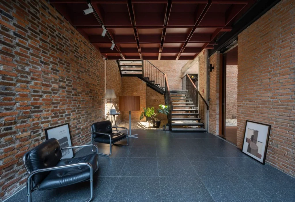 Ground-floor seating and circulation space looking toward the open courtyard