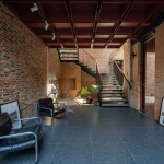 Ground-floor seating and circulation space looking toward the open courtyard