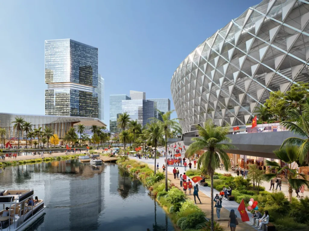 Close view of the stadium’s diamond lattice facade beside a canal lined with people carrying Vietnamese flags