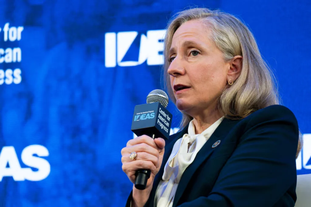 Virginia Governor Abigail Spanberger speaking at a podium during a conference in Washington, D.C.