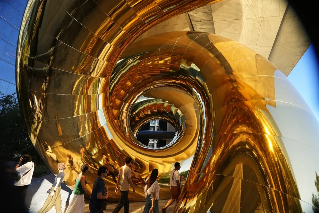 Looking upward through the spiraling golden membrane of auruBOROS