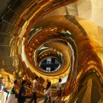 Looking upward through the spiraling golden membrane of auruBOROS