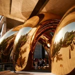 Detailed view of the inflated golden surfaces forming tight spiral curves
