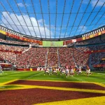 Daytime interior rendering of the continuous seating bowl under the glass roof of the new Commanders stadium