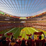 Wide view of the stadium interior showing the steep stands and translucent roof structure