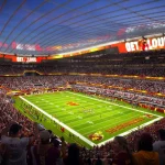 Night rendering of the Commanders stadium bowl with illuminated field and crowd