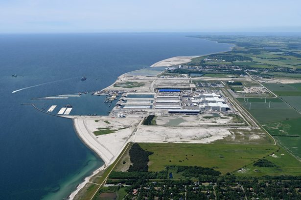 Wider aerial showing Denmark's reclamation area, industrial facilities and surrounding coastline