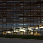 Facade of Patrimonium Headquarters showing extensive horizontal brise-soleil elements