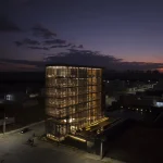 Night view of the illuminated corner building in Lagoa da Prata