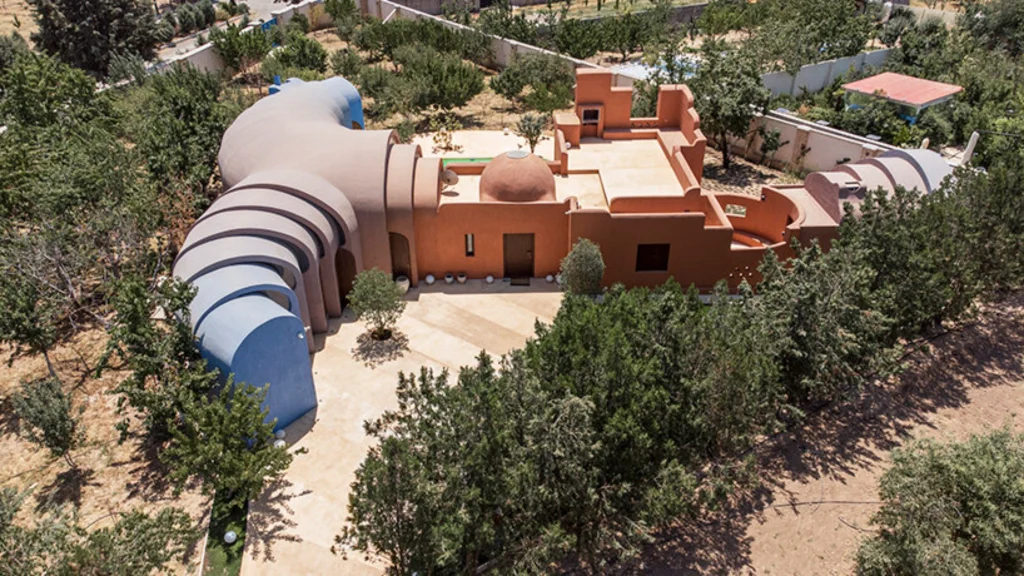Aerial view of Gelareh House showing the spiraling sequence of vaults woven through the fruit orchard
