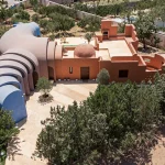 Aerial view of Gelareh House showing the spiraling sequence of vaults woven through the fruit orchard