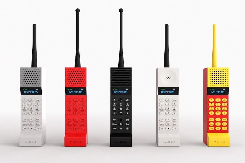 Five color variations of the ADHD ONE handset lined up side by side in grey, red, black, white and yellow by Kevin Noki