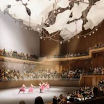 Interior rendering of a ballet performance on stage with full audience and orchestra in the round hall