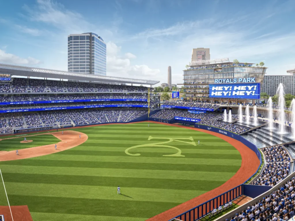 High-angle view of the playing field with outfield fountains, scoreboards and city buildings beyond