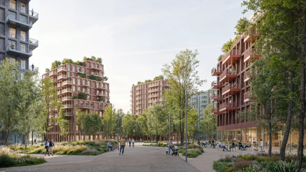 Curving pedestrian path lined with trees and outdoor seating, surrounded by terracotta and red brick apartment buildings with green roofs