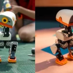 Side-by-side photos of two Microduck robots standing on colourful floors, one grey with yellow accents and one white with orange accents