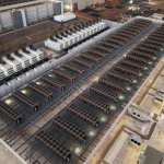 Elevated view of extensive data center cooling infrastructure, showing rows of industrial cooling units, ventilation equipment, and mechanical systems
