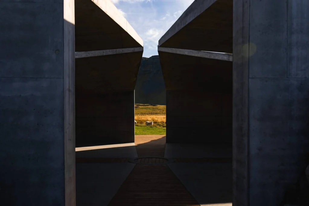 Looking out from inside the Temple through the concrete opening to sheep grazing in the field