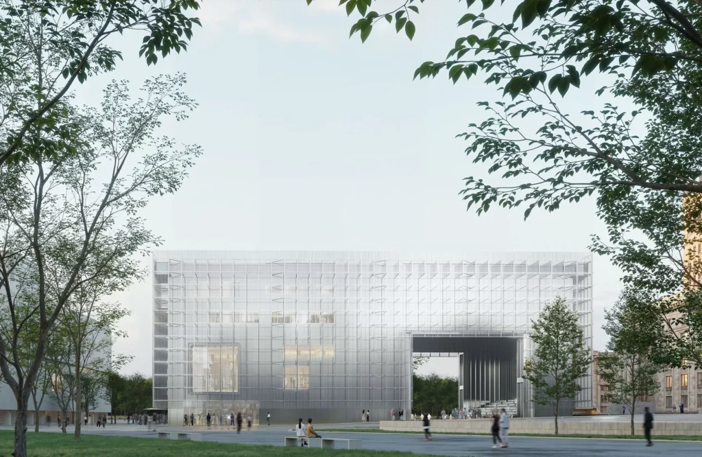Large translucent white building designed by Thomas Phifer, featuring a gridded façade and monumental arched opening, set in a landscaped public square with people walking.