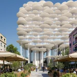 Street-level perspective of the layered perforated white disks rising above outdoor cafés and pedestrians