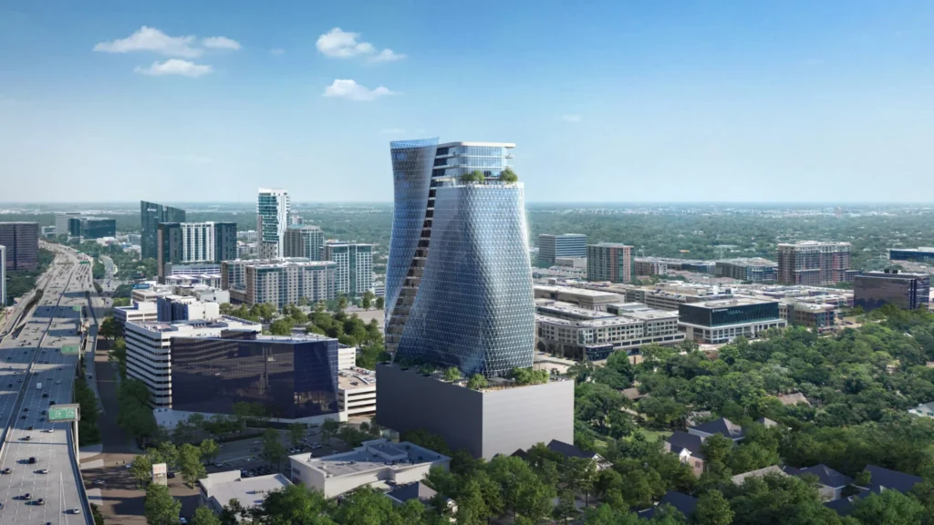 Wide aerial perspective of the O27 skyscraper near a highway with the Houston skyline in the background