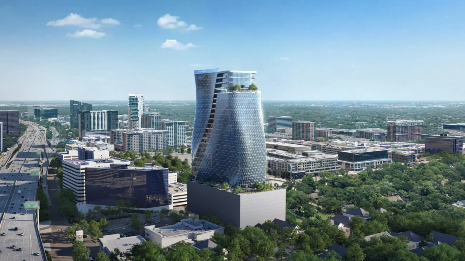 Wide aerial perspective of the O27 skyscraper near a highway with the Houston skyline in the background