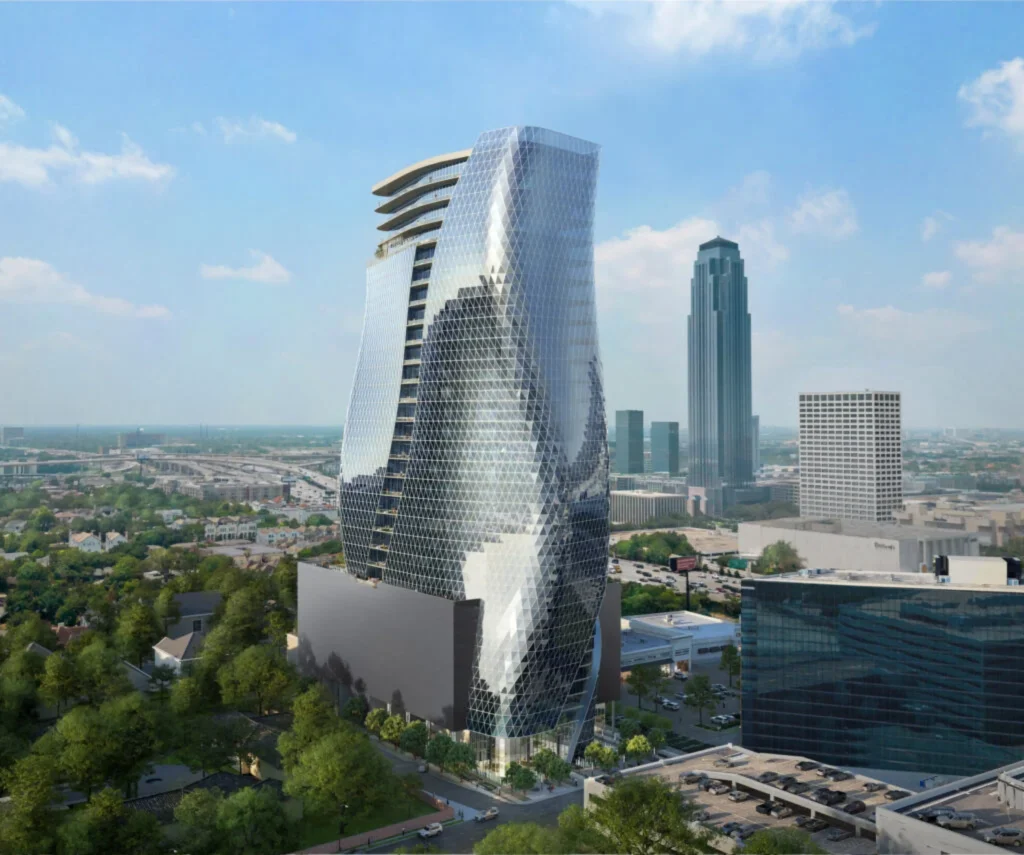 Close aerial of the twisting triangular-panelled glass tower with rooftop terrace and surrounding streets