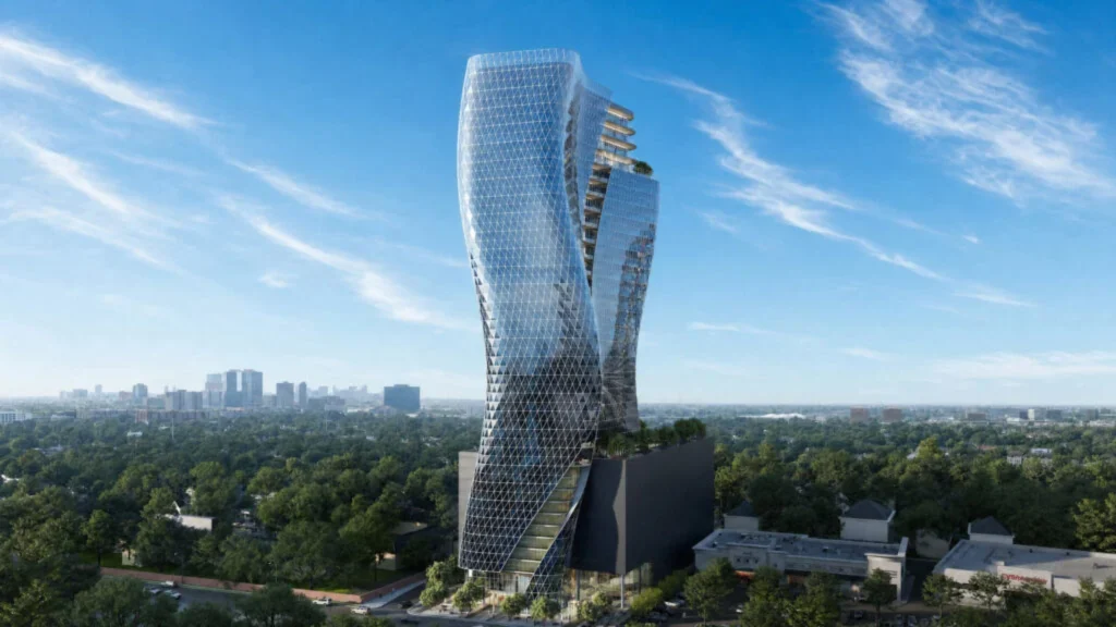 Aerial view of the sinuous glass O27 tower rising above a dark podium amid green surroundings and distant Houston skyline