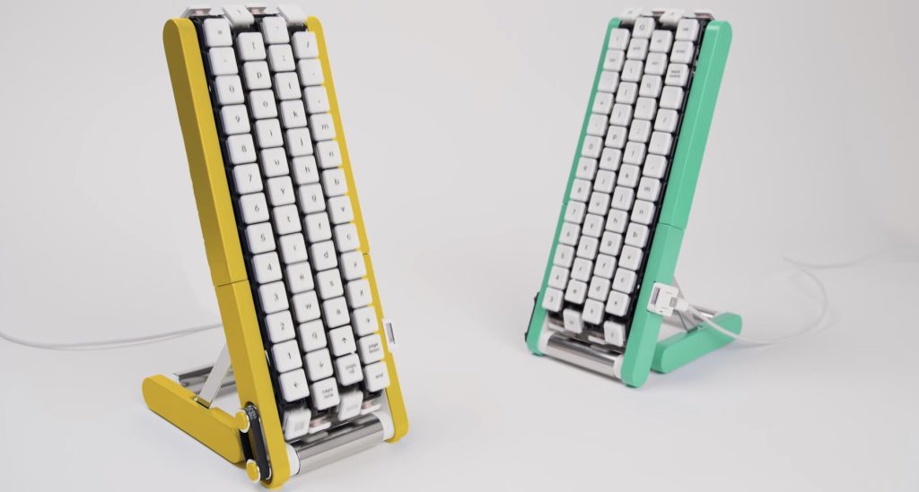 Two Gboard conveyor-belt keyboards in yellow and mint green standing side by side