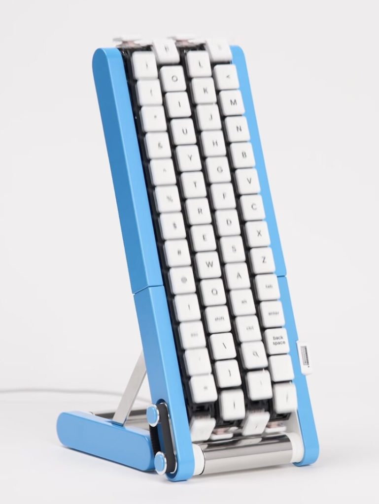 Blue Gboard conveyor-belt keyboard standing upright on a white background, showing white keycaps