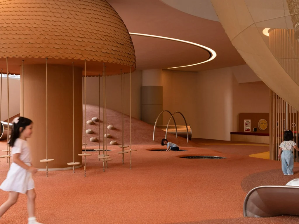 Snøhetta Children playing in a warm terracotta indoor landscape with a scaled dome structure, hanging discs and soft hills