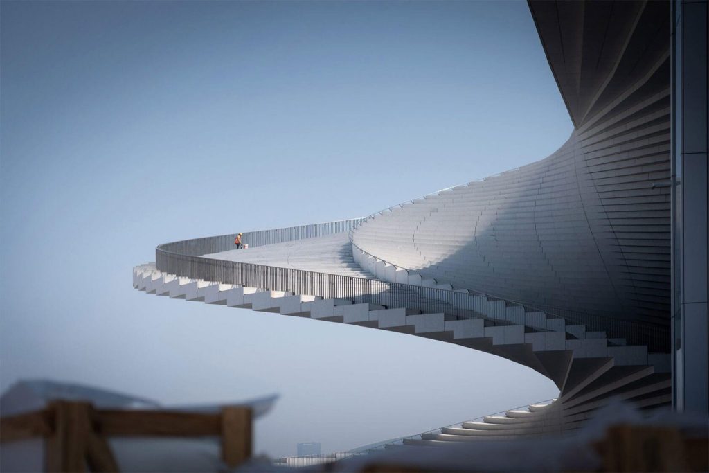 Distant view of a single person walking along the high curved edge of the white spiral roof