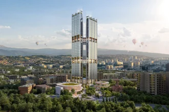 Aerial rendering of the twin skyscrapers rising above green parkland and the city of Yerevan, with hot-air balloons in the sky