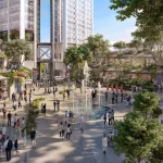 Lively public plaza at the base of the twin towers with a central fountain, trees, outdoor seating and people gathering under Armenian flags